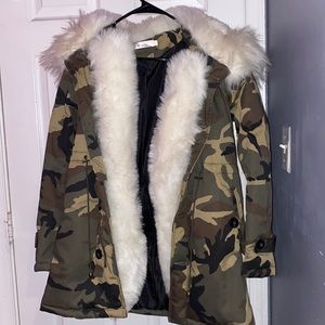 Camouflage winter coat with white fur trimming